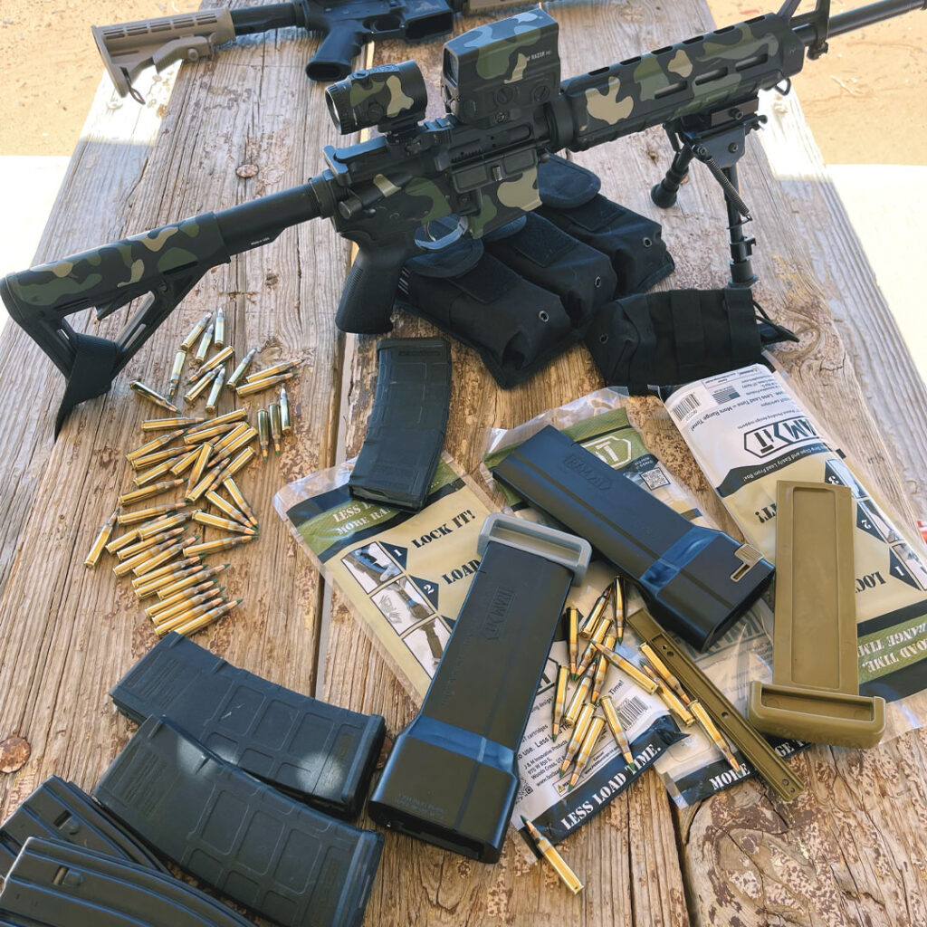 Shooting range table with AR-15 Ram-It Speed Loader and ammo